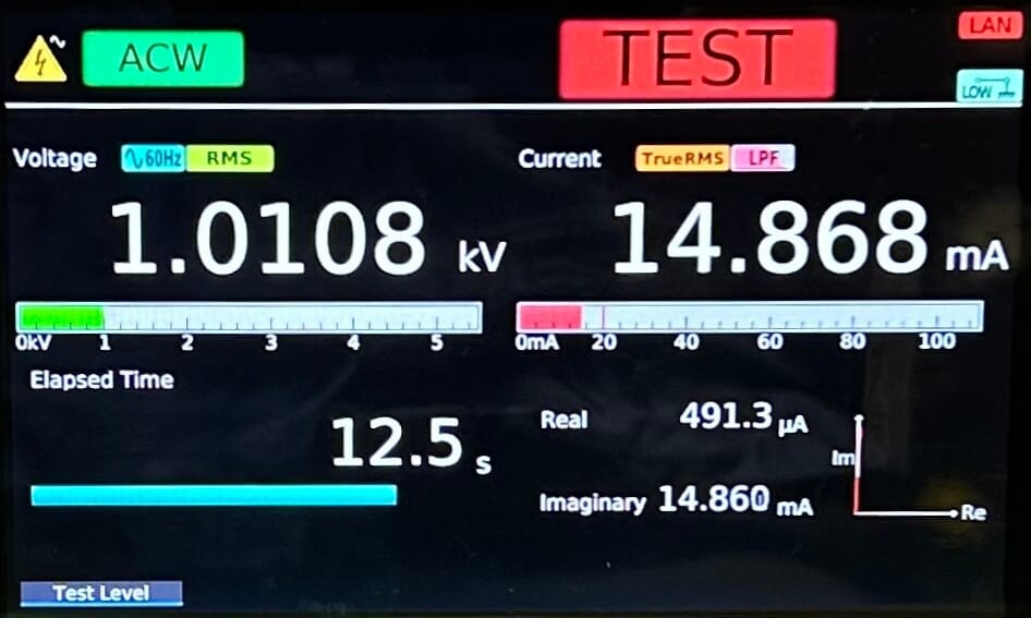 Test in Progress — voltage and current continuously displayed